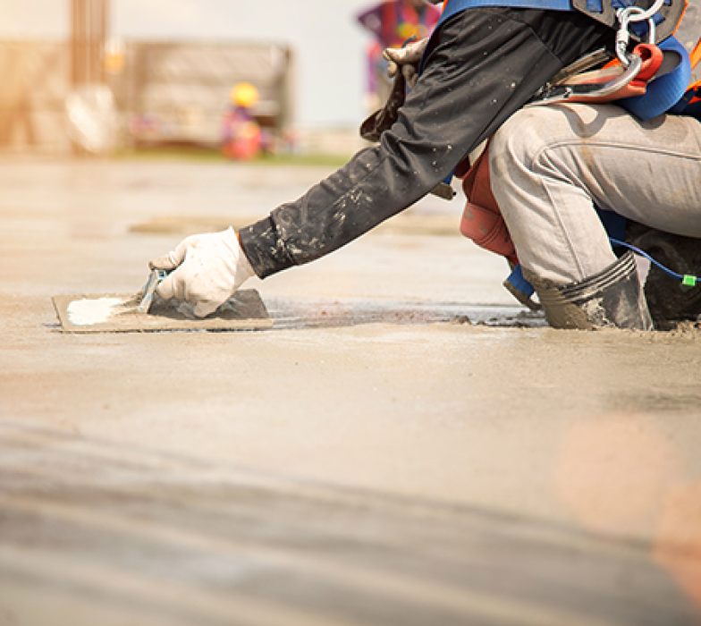 Construction worker Concrete pouring during commercial concreting floors of building in construction site and Civil Engineer
